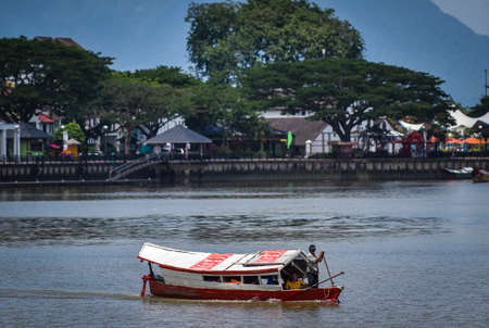 KUCHING SARAWAK MALAYSIA - OCTOBER 26, 2017. Traditional wooden boat at Kuching Waterfront Sarawak River. The boat used as water taxi in Kuching City.のeditorial素材