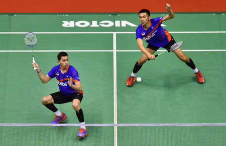 KUALA LUMPUR, MALAYSIA - JANUARY 21, 2018 : Fajar Alfian and Muhammad Rian Ardianto of Indonesia Men's Doubles during the Perodua Malaysia Masters 2018 at Axiata Arena, Bukit Jalil.のeditorial素材