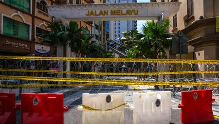 KUALA LUMPUR, MALAYSIA - APRIL 18, 2020 : Barbed wire road close during the 'movement control order' COVID-19 outbreak.のeditorial素材