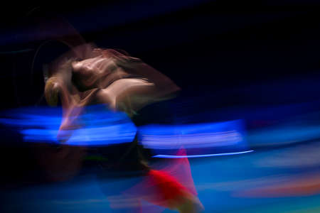 KUALA LUMPUR, MALAYSIA - APRIL 02, 2019 : Lin Dan of China in action with slow motion effect of the Badminton Malaysia Open at Axiata Arenaのeditorial素材