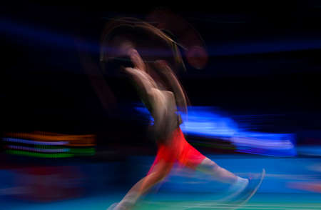 KUALA LUMPUR, MALAYSIA - APRIL 02, 2019 : Lin Dan of China in action with slow motion effect of the Badminton Malaysia Open at Axiata Arenaのeditorial素材