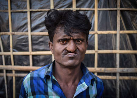 COX' BAZAR, BANGLADESH - MARCH 16, 2019 : Face of Rohingya refugees from Myanmar waiting for food...