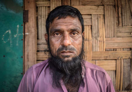 COX' BAZAR, BANGLADESH - MARCH 16, 2019 : Face of Rohingya refugees from Myanmar waiting for food aid in Kutupalong refugee camp near Cox's Bazar, Bangladesh.のeditorial素材