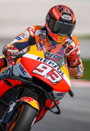 Kuala Lumpur, Malaysia - February 07, 2019 : Repsol Honda Team's Spanish rider Marc Marquez presses his left shoulder during the 2019 MotoGP pre-season testing at the Sepang International Circuitのeditorial素材