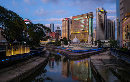 Kuala Lumpur, Malaysia - January 08, 2020 : View of the River of life, Masjid Jamek and the blue pool in the heart of city center Kuala Lumpur during blue hourのeditorial素材