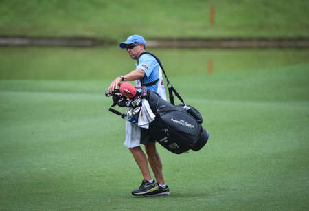 Kuala Lumpur, Malaysia - October 11, 2018 : Caddy at work  during CIMB Classic 2018 at TPC Kuala Lumpur.のeditorial素材