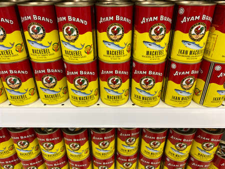 KUALA LUMPUR, MALAYSIA - APRIL 15, 2020 : Ayam Brand Mackerel and Sardines fish display on the shelf at supermarket.のeditorial素材