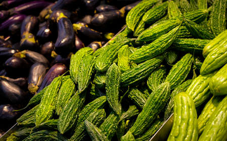 KUALA LUMPUR, MALAYSIA - APRIL 15, 2020 : Fresh bitter gourd display on the shelf at supermarket.のeditorial素材