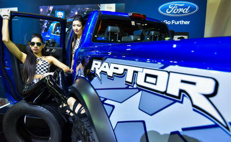 KUALA LUMPUR, MALAYSIA - DEC 3, 2019 : Girl pose with Ford Raptor displayed at Kuala Lumpur...