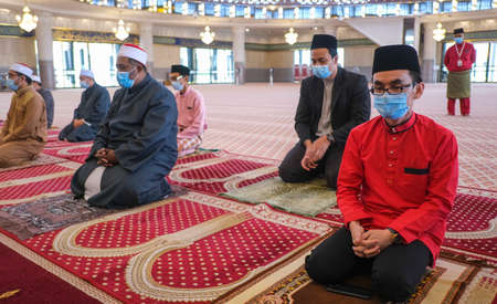 PETALING JAYA, MALAYSIA - MAY 14, 2020 : Social distancing muslim prayer inside the National Mosque...
