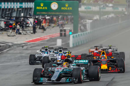 KUALA LUMPUR, MALAYSIA - OCTOBER 1, 2017 : Lewis Hamilton of Great Britain Mercedes AMG Petronas F1 Team (front) lead the race on track during Malaysia Formula One Grand Prix at Sepang Circuit.のeditorial素材