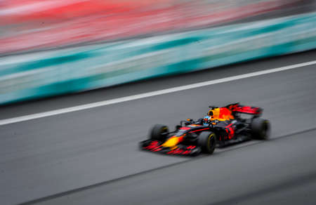 KUALA LUMPUR, MALAYSIA - OCTOBER 1, 2017 : Daniel Ricciardo of the Netherlands driving the Red Bull Racing Red Bull on track with slow motion during Malaysia Formula One Grand Prix at Sepang Circuitのeditorial素材