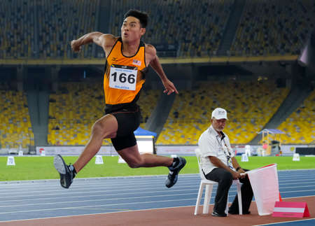 KUALA LUMPUR, MALAYSIA - AUGUST 24, 2017 : Athlete in action of triple jump during 29th Southeast...