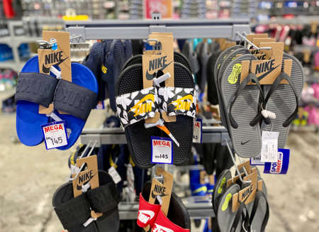Kuala Lumpur, Malaysia - May 18, 2020 : Row of Men Nike slipper on display in local sports outletのeditorial素材