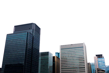 Tokyo glass modern building against bright sky.