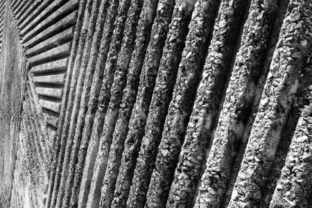 Groovy Concrete wall with pattern of lines in the park