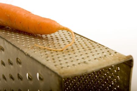 Carrot on the old graterの写真素材