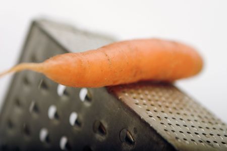 Carrot on the old grater 1の写真素材