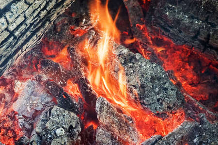 a flame of a fire and ashes