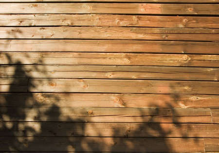 Background from brown boards with  a shadowの写真素材