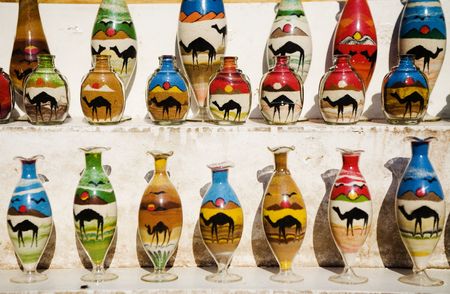 egyptian (arabic) souvenir - colored sand in the glass bottles in the showcase.の写真素材