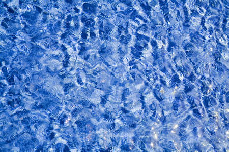 the sun reflected in the abstract water
