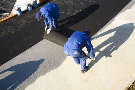 the workers in a blue working overalls'sの写真素材