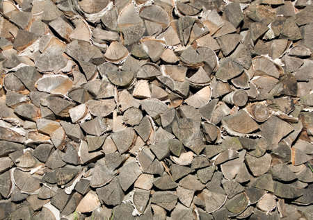 a pile of gray chopped firewood
