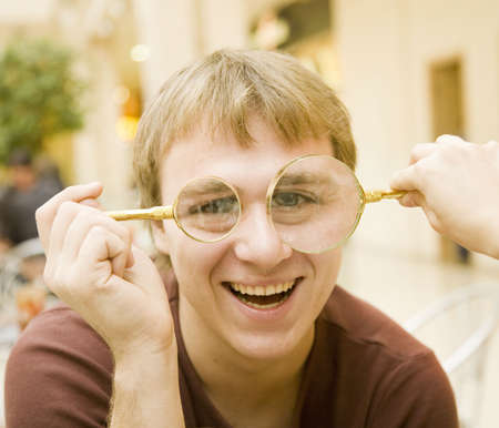 man's smile with two lensの写真素材