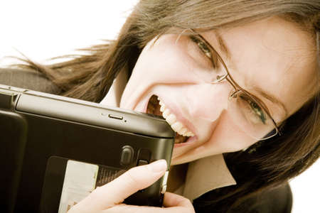 Businesswoman bite laptopの写真素材