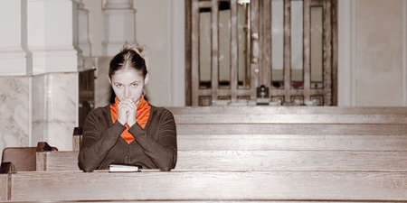 girl pray in a catholic churchのeditorial素材