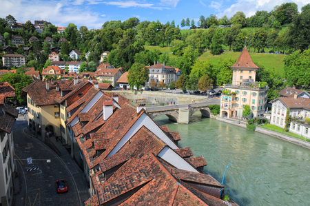 Aerial view of street and roofs of old building on Aare river bank in Bern, Switzerland
