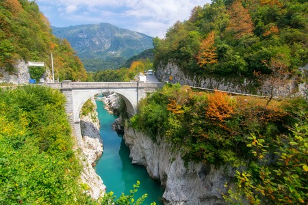 Amazing view of Soca (Isonzo) river and Napoleon's bridge near Kobarid (Caporetto) Slovenia. Soca river and Kobarid - popular place for active recreation in Julian Alps and place of World War I memoryの写真素材