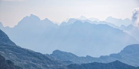 Scenic view of blue ridge in hazy mountains. Julian Alps, Sloveniaの写真素材