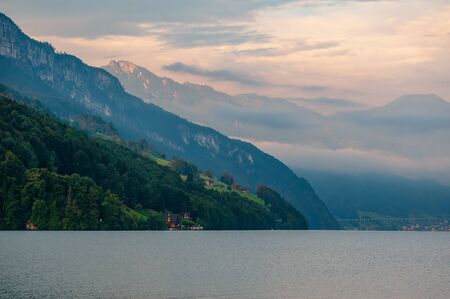Scenic view of mountains over Lucerne Lake - Vierwaldstattersee - under picturesque sky, Canton of Uri, Switzerland. 'Lake of the Four Forested Settlements' - popular tourist attractionの写真素材