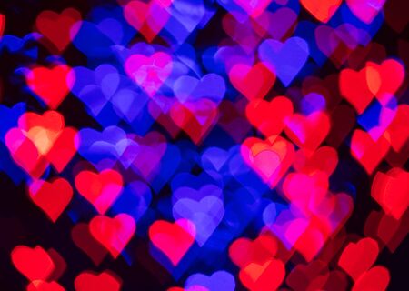 Red and blue hearts bokeh as background for Valentine's day