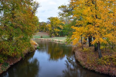 Muskau Park and Neisse river at autumn morning. German-Polish border.の写真素材
