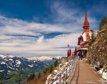 INTERLAKEN, SWITZERLAND - MAY 7, 2019: Harder Kulm View point. Popular travel destination in Interlaken. Breathtaking view over Interlaken and Swiss Alpsのeditorial素材