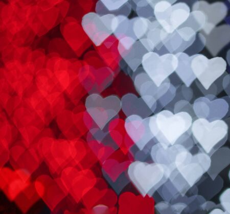 Red and white hearts bokeh as background for Valentine's day.の写真素材