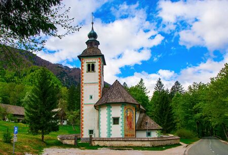 Scenic view of church of the Holy Spirit on the southern side of the Bohinj Lake, near road Ribcev Laz - Ukanc, Sloveniaの写真素材