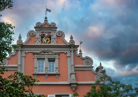 Baroque gable of historic building in old town of Konstanz, Baden-Wurttemberg, Germany. Picturesque burning skyの写真素材