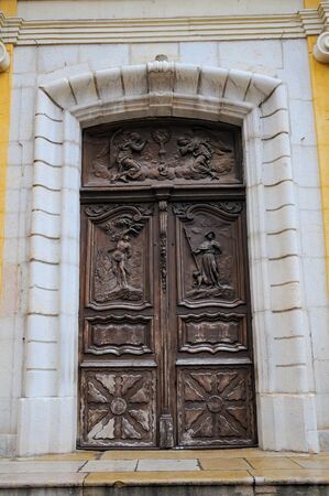 Amazing carved door of Church of the Immaculate Conception in Antibes, France.の写真素材
