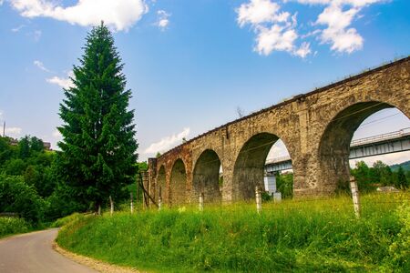 Historical abandoned railway arch bridge viaduct in Vorokhta, Ivano-Frankivsk Region, Ukraine.の写真素材