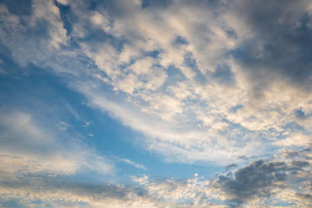 Majestic clouds illuminated by sunrise. Sky background.の写真素材