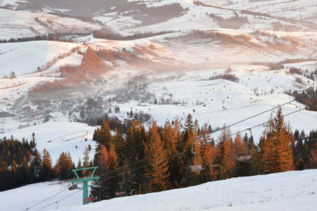 Winter mountains landscape on ski resort on sunrise light.の写真素材