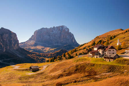 Amazing view on Sassolungo - Langkofel - mountain and Gardena Pass ander autumn sun. Dolomite Alps, South Tyrol, Italy.の写真素材