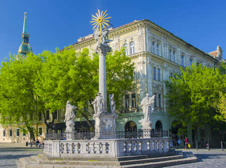 Plague Column at Rybne Namestie - Fish Square - in Bratislava, Slovakia at sunny spring dayの写真素材
