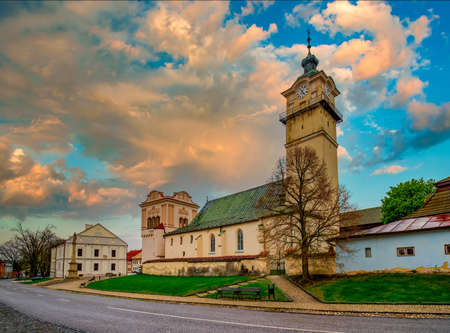 Gothic church of St. George (Juraj), Renaissance bell tower, old town hall and Marian column in the main square of Spisska Sobota, Poprad, Slovakia. Picturesque burning sky. Popular travel destinationの写真素材