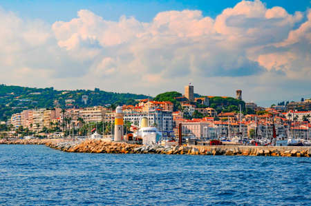 Picturesque view to old city and harbor in Cannes from the sea, French Riviera, France.の写真素材