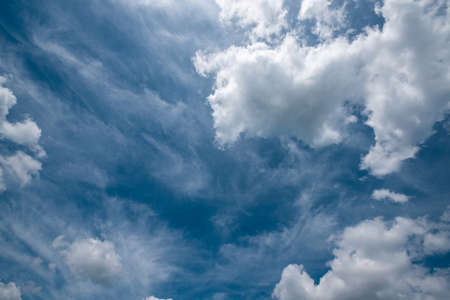 Beautiful sky background with fluffy and cirrus clouds.の写真素材